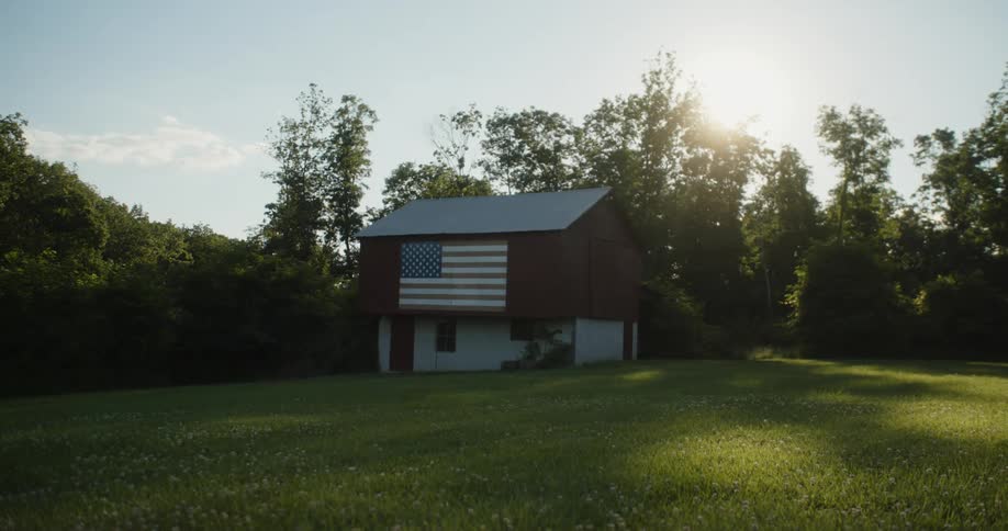 A barn has a large flag painted on it