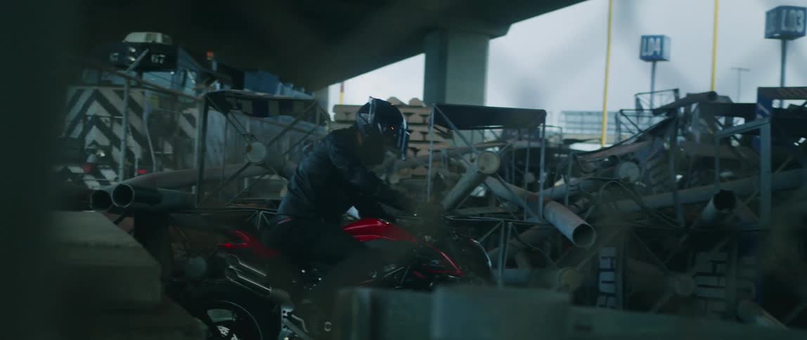 There is a young white man that is sitting on the motorcycle