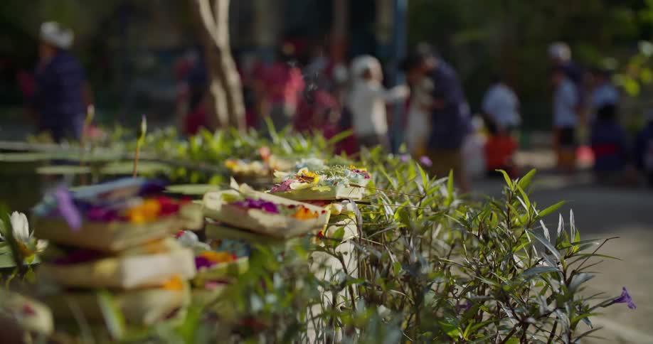 Religious offerings sit next to a fountain in Indonesia