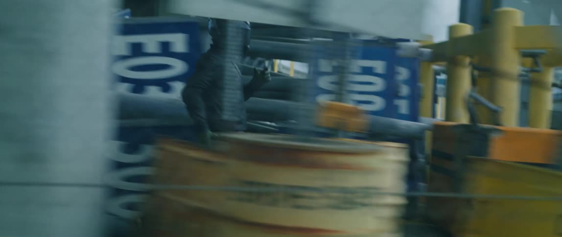 A man runs and gets on his motorcycle