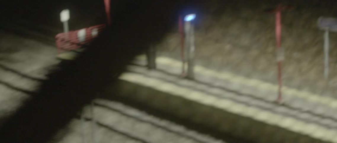 Passing by a train station at night