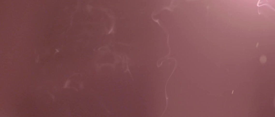 Smoke and sparks in a dark room
