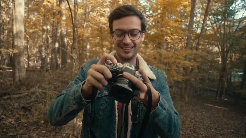 A photographer out in a forest