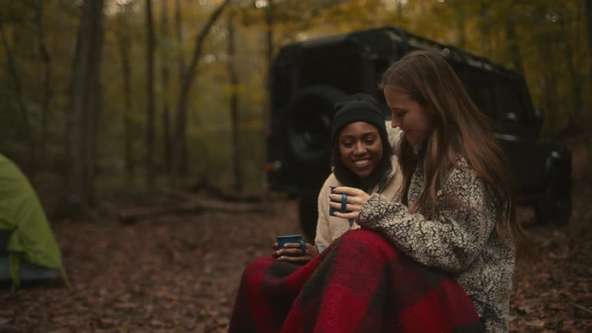 Two women sitting outdoors