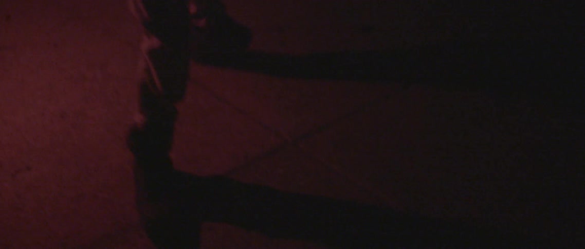 Person spinning around in the dark while holding a flare