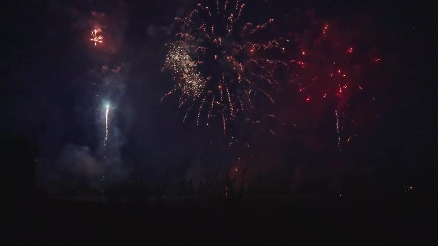 People watch the fireworks at night