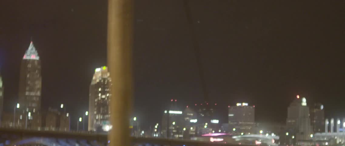 A boy is running at night looking behind