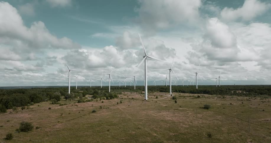 Wind turbines in a field on a wind farm
