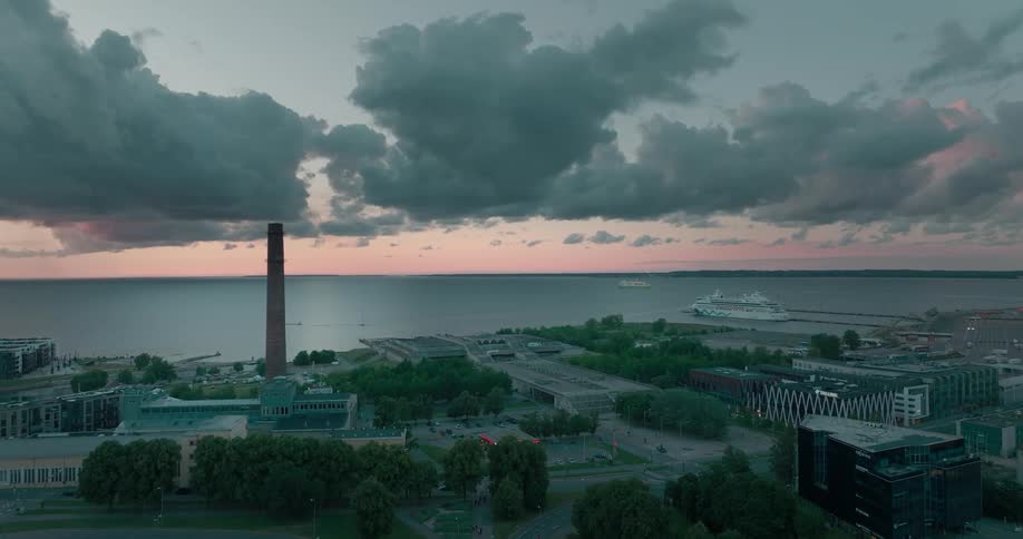 An aerial view of cars driving in a city on the coast