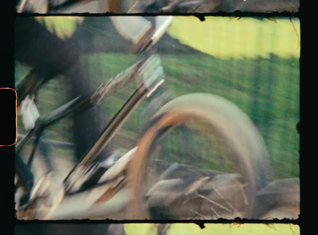 A man rides his bicycle over a set of stairs outdoors