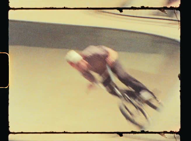 A man rides his bike around the ramps