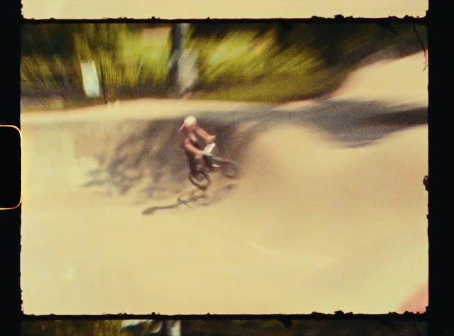 A person is riding their bike in the park