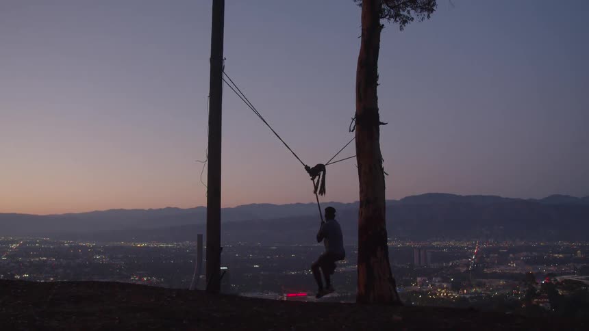 A young man is outdoors in the middle of the daytime