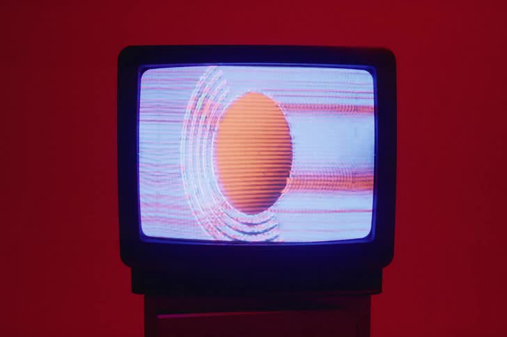 Red and white static play on a television