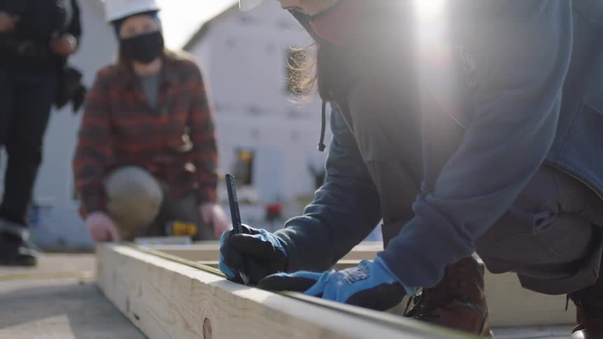 A group of construction employees are working outdoors
