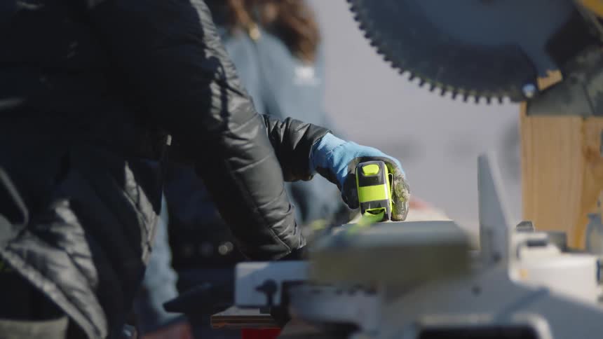 There are workers working in the factory together