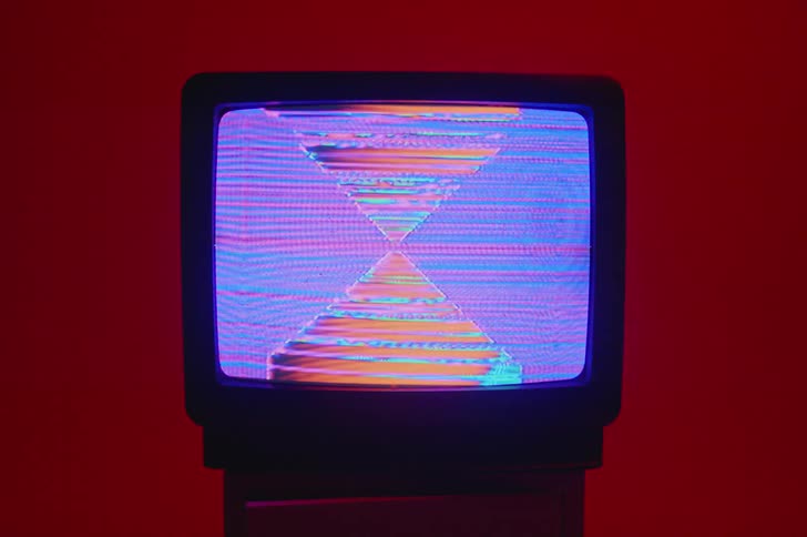 There is a television screen that is showing colors on it