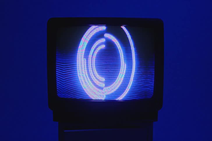 A vintage television screen is displayed in a room
