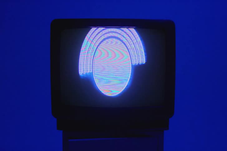 A vintage television is displayed in a room