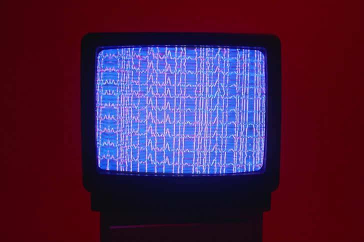 A television screen with no signal is displayed