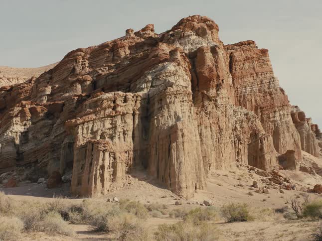 Aerial view of a canyon in a desert is displayed at dusk