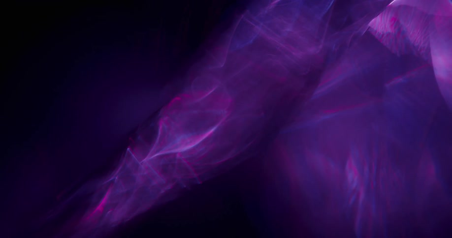An organic purple aura moves upward and glows as it grows in dimension and spreads across the darkness
