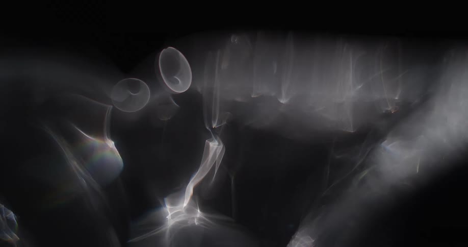 A smokey substance drops shapeshifting orbs into the air as it moves across the darkness