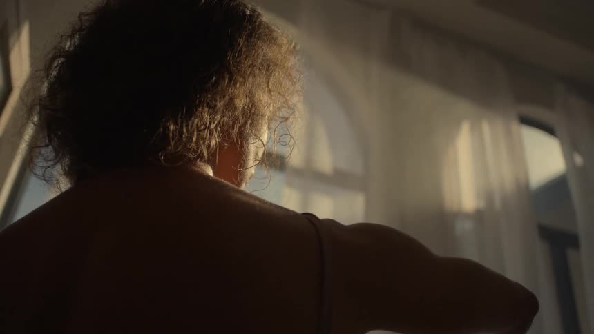 A woman is dancing in the room