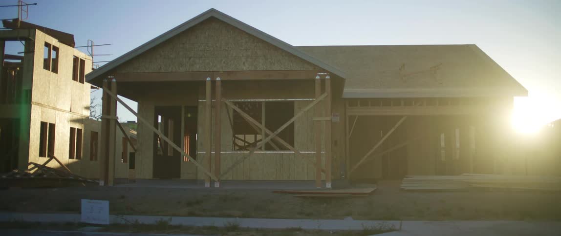 A home under construction in a neighborhood