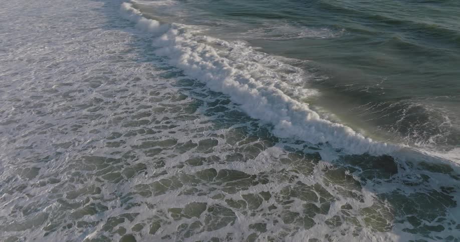 Aerial view of waves crashing in the ocean
