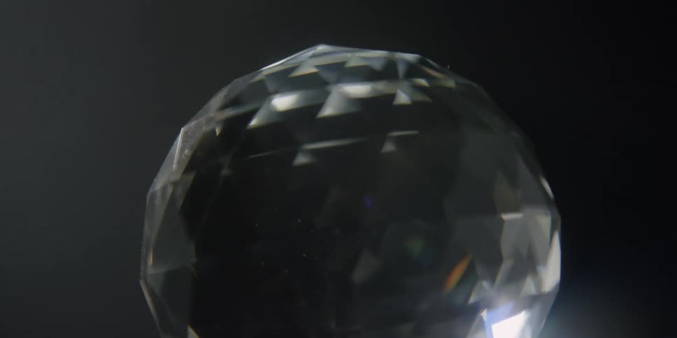 There is a disco ball that is moving slowly