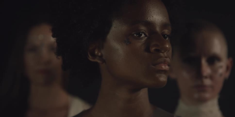 Close up view of three woman standing by each other