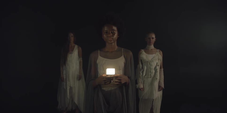 There are three young women that are standing next to each other
