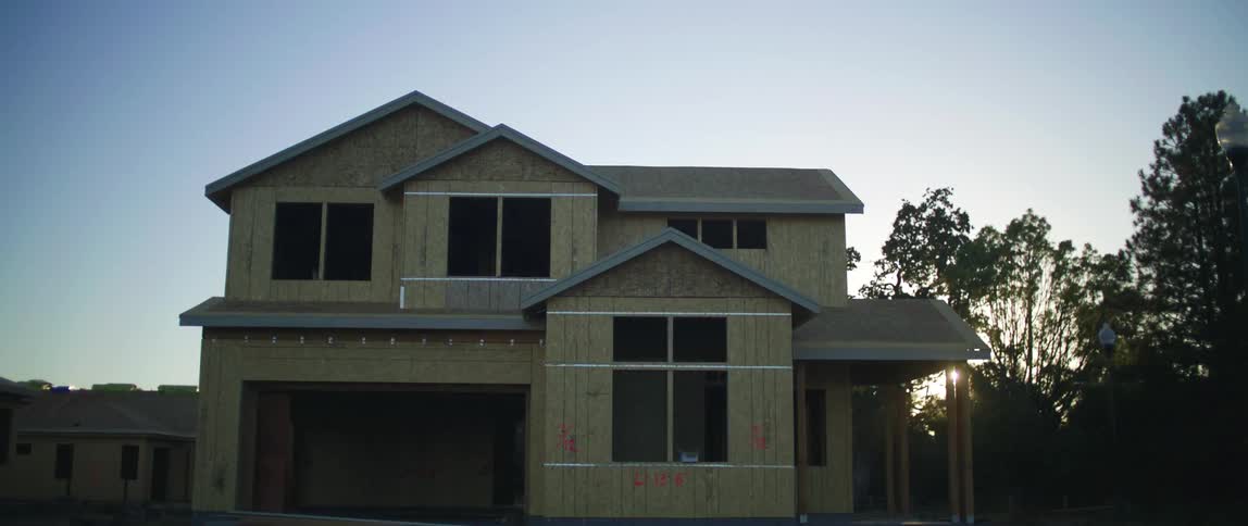 A house in a neighborhood is on display during dusk