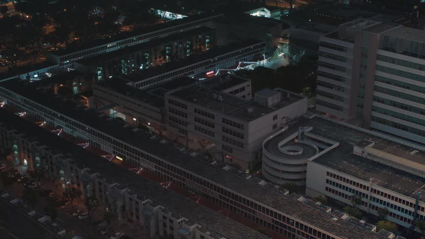 Time lapse of buildings changing from day to night