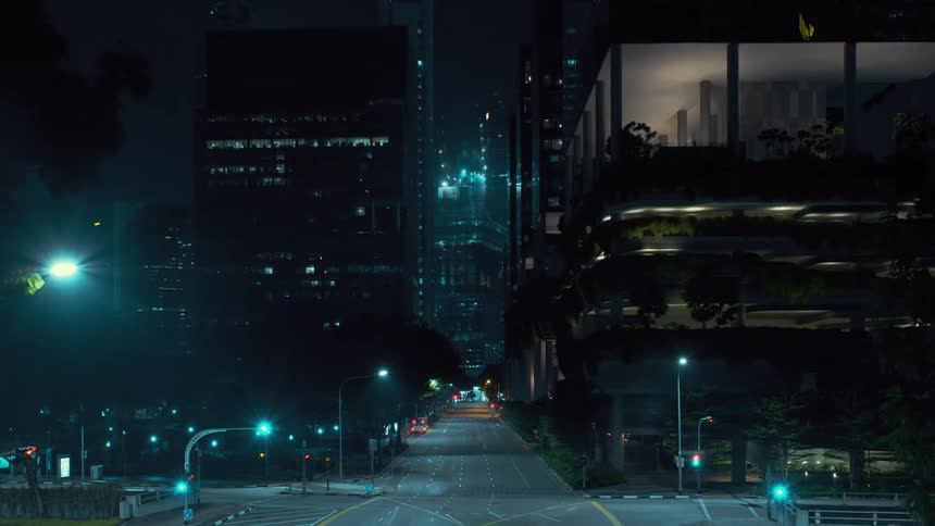 A time lapse shows multiple vehicles traveling down a city street at night