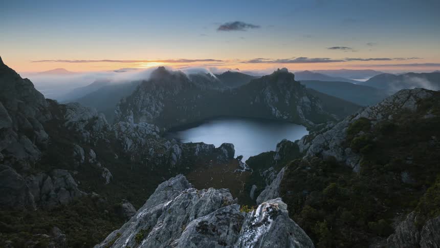 The sun rises on the mountains