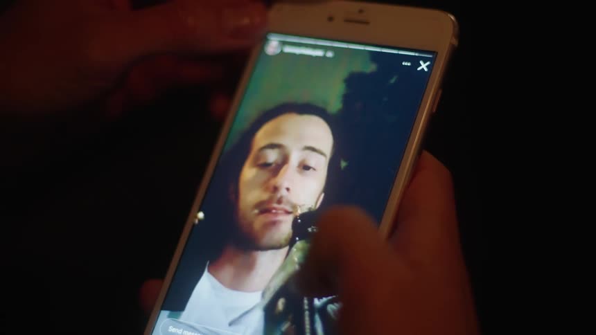 A man drinks alcohol on the video call