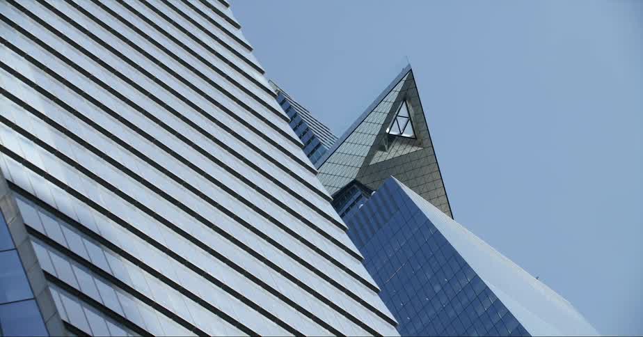 Tall buildings downtown with unique and unusual architecture