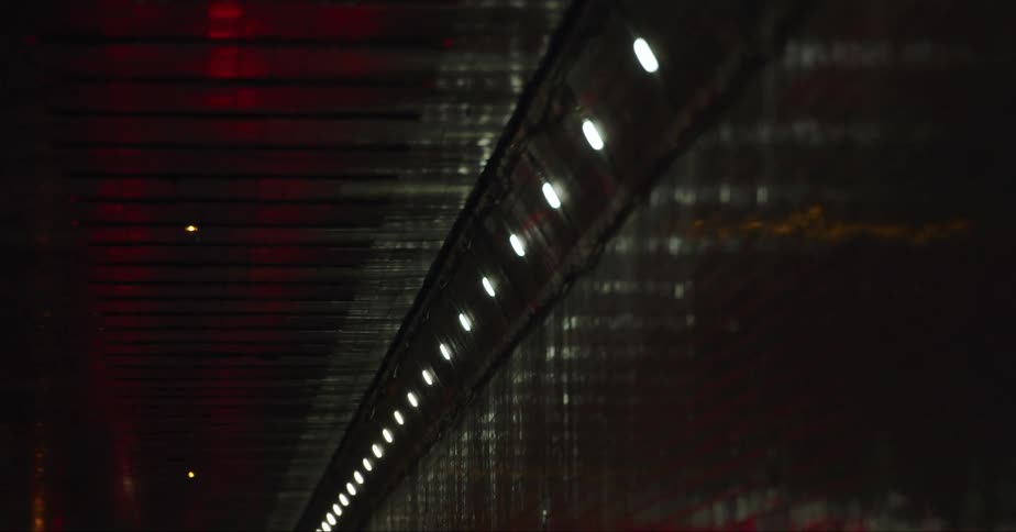 A view of the ceiling & reflections in a tunnel