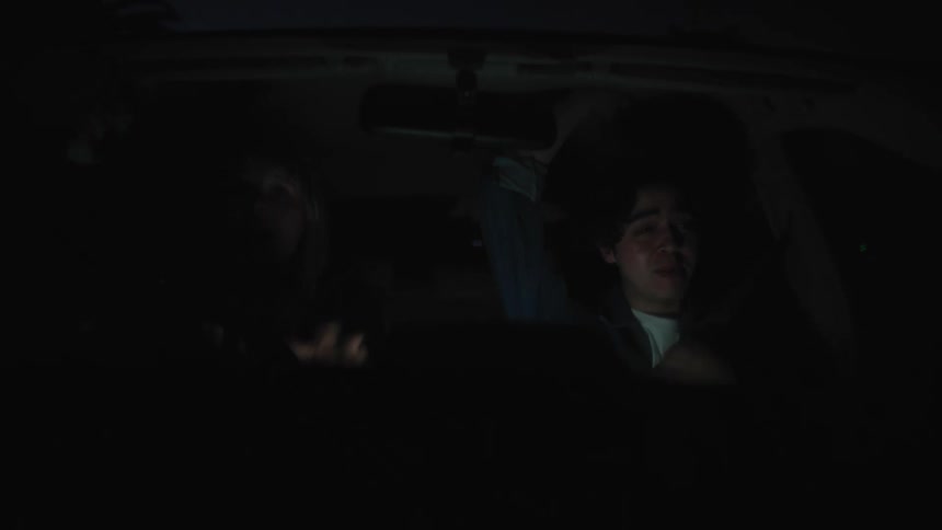 Two people argue while traveling in a vehicle