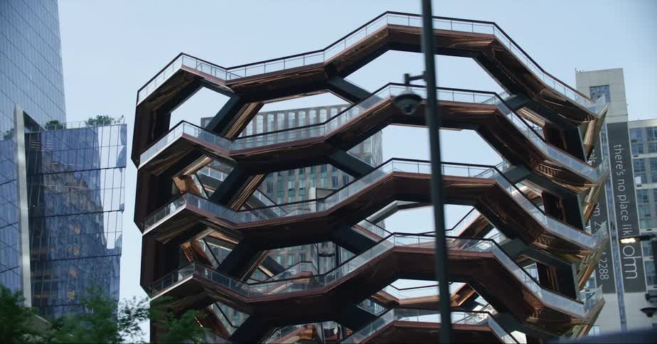 A large walkway in a downtown area in front of high rise office buildings