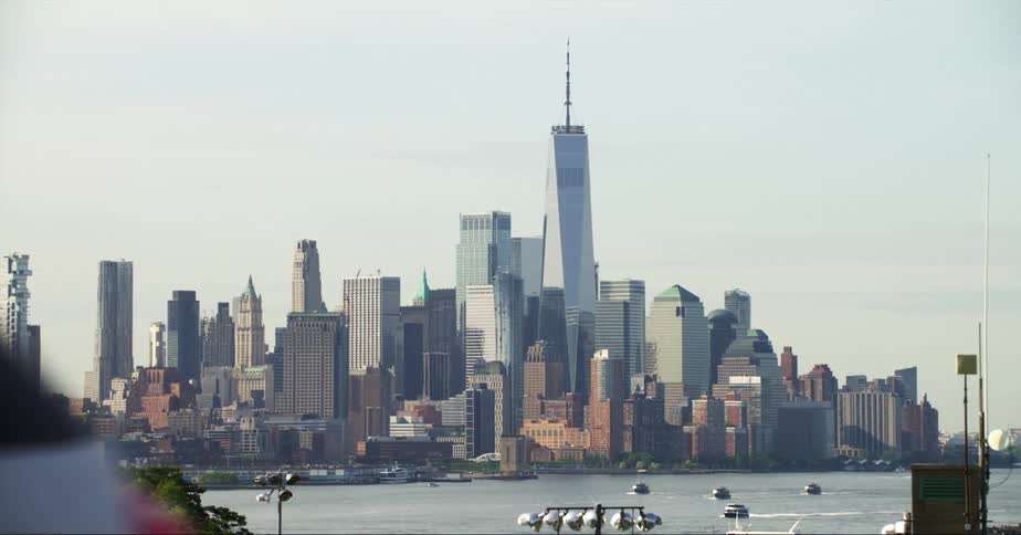 Distant view of city skyscraper and high rise buildings near the sea