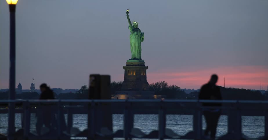 The statue of liberty in new york city at night