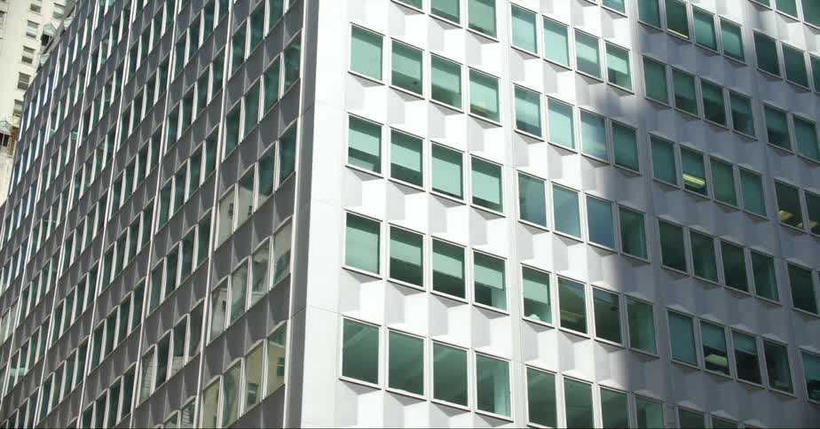 Close up view of a building in a downtown city is displayed