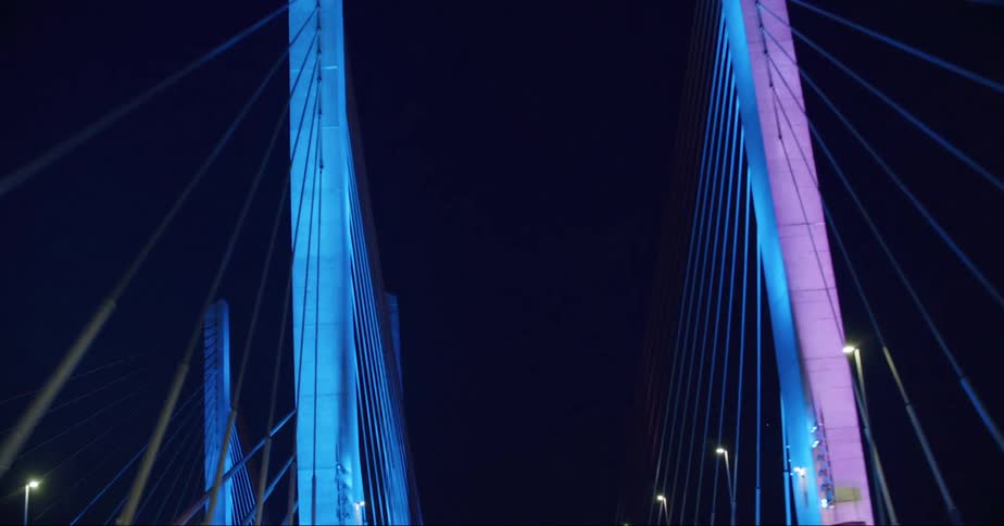 Bright colorful changing lights on the columns of the oresund bridge at night