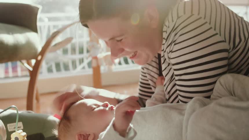 A mother plays with her son
