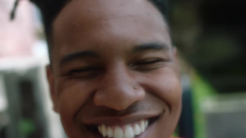Close up of a teenage boy laughing