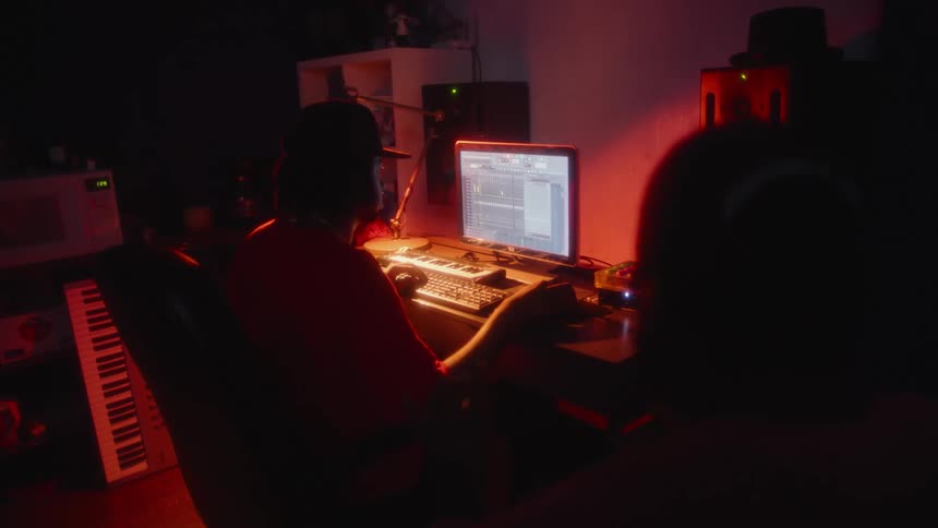 People making music in a recording studio