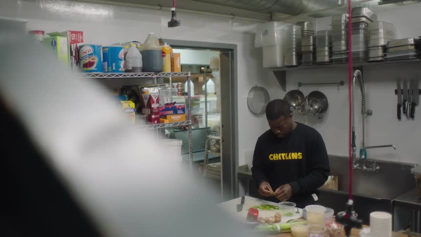 A man cooks in a restaurant